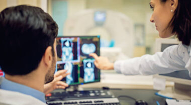 Doctors are working with CT scan in hospital