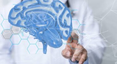 A businessman hand using 3D rendering globe network brain hologram